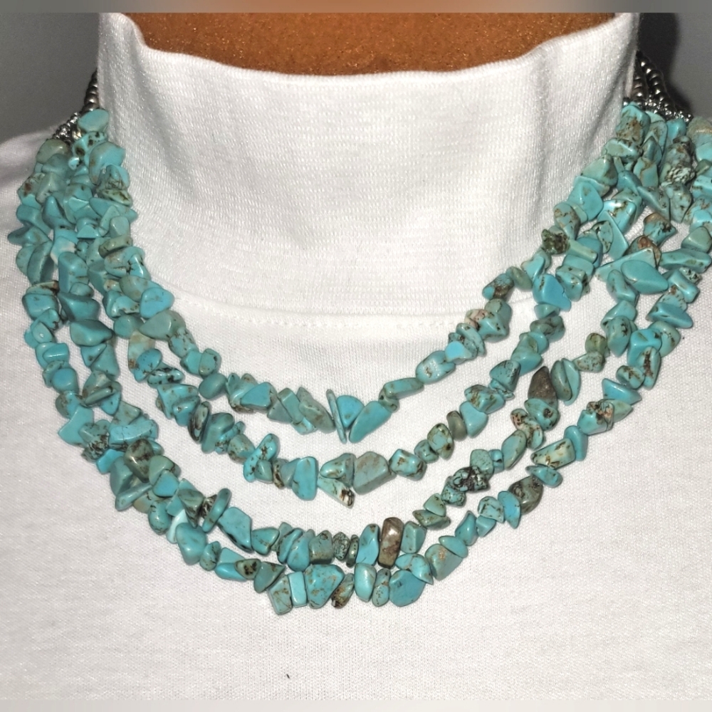 Four strand turquoise and silver beads necklace.